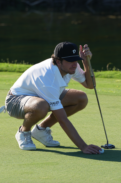 Side angle of the DIALED black rope hat showcasing the classic rope detail and curved brim.