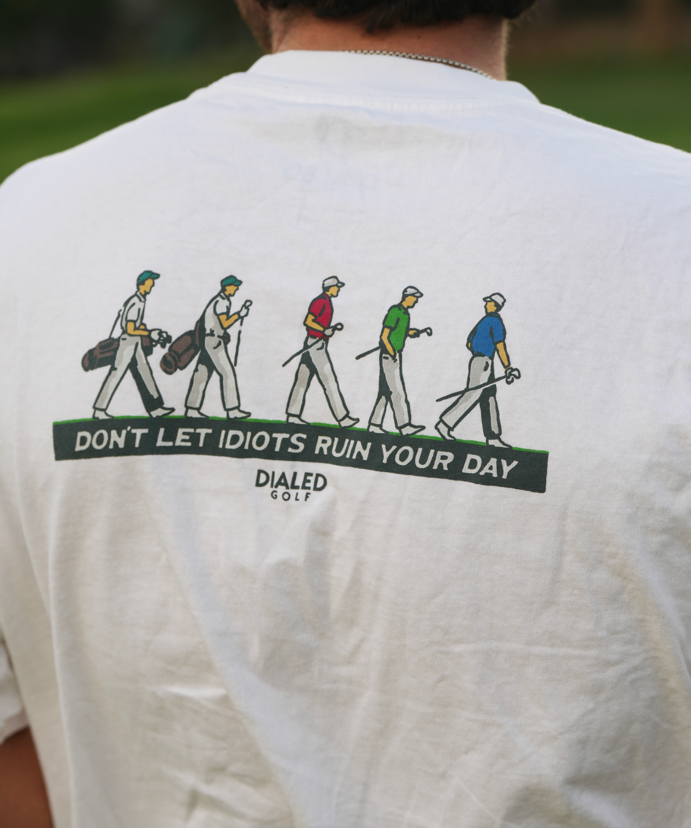 Close-up of the golfer illustration and slogan, screen printed for durability and texture.