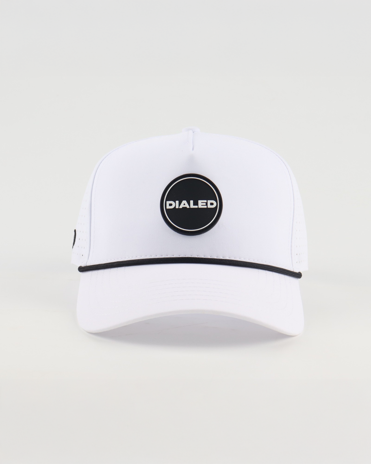 White performance rope golf hat with circular logo patch

White rope-style performance golf hat by Dialed Golf

Lightweight white golf hat with circular patch logo