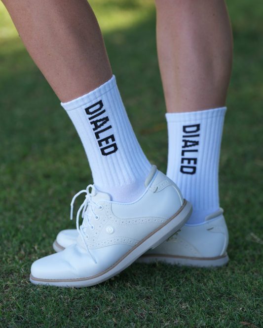 • White Dialed crew socks with side logo
• White performance crew socks by Dialed
